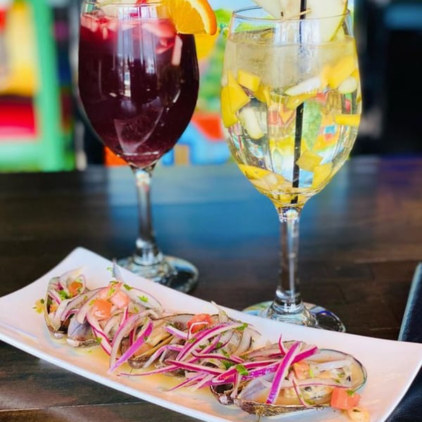 El Jalapeño Bar & Grill's ceviche with red onions and two colorful cocktails.